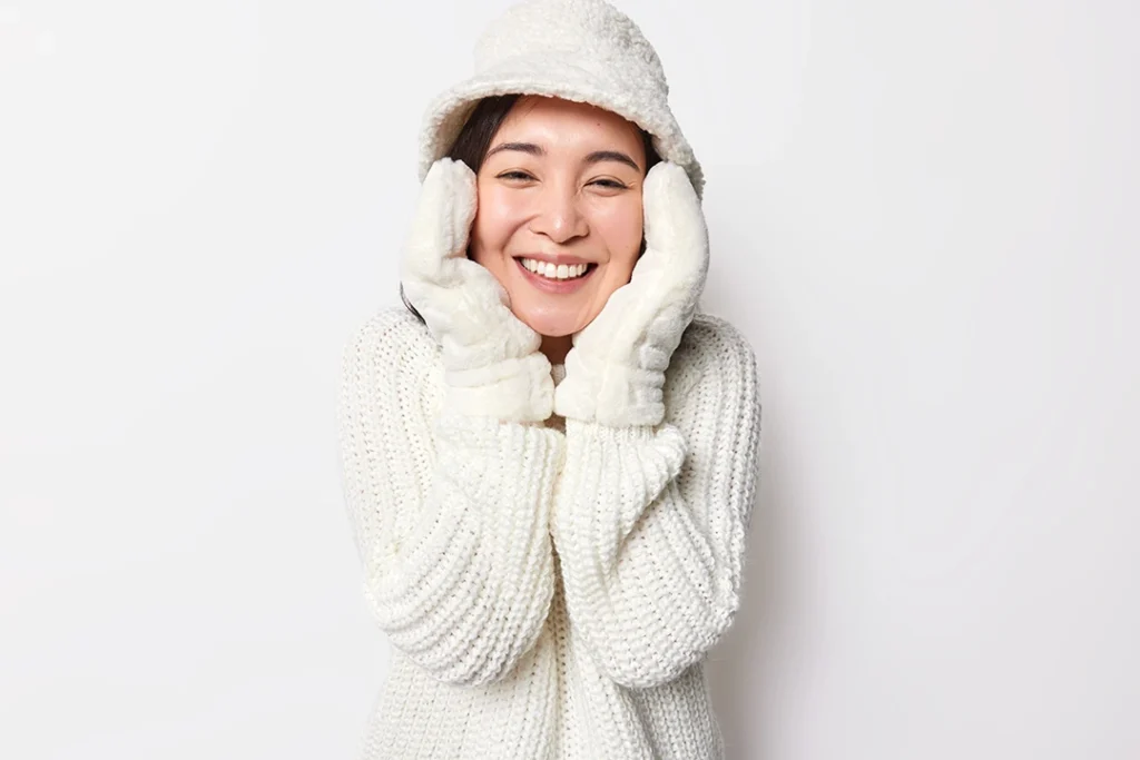 Smiling woman in warm winter clothing