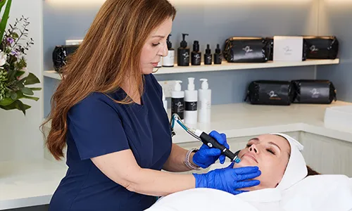 Patient receiving a microdermabrasion treatment